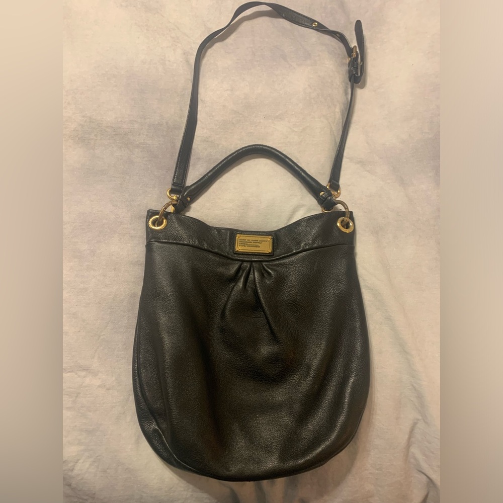 Crossbody hobo bag with adjustable and removable straps.  Magnetic closure.